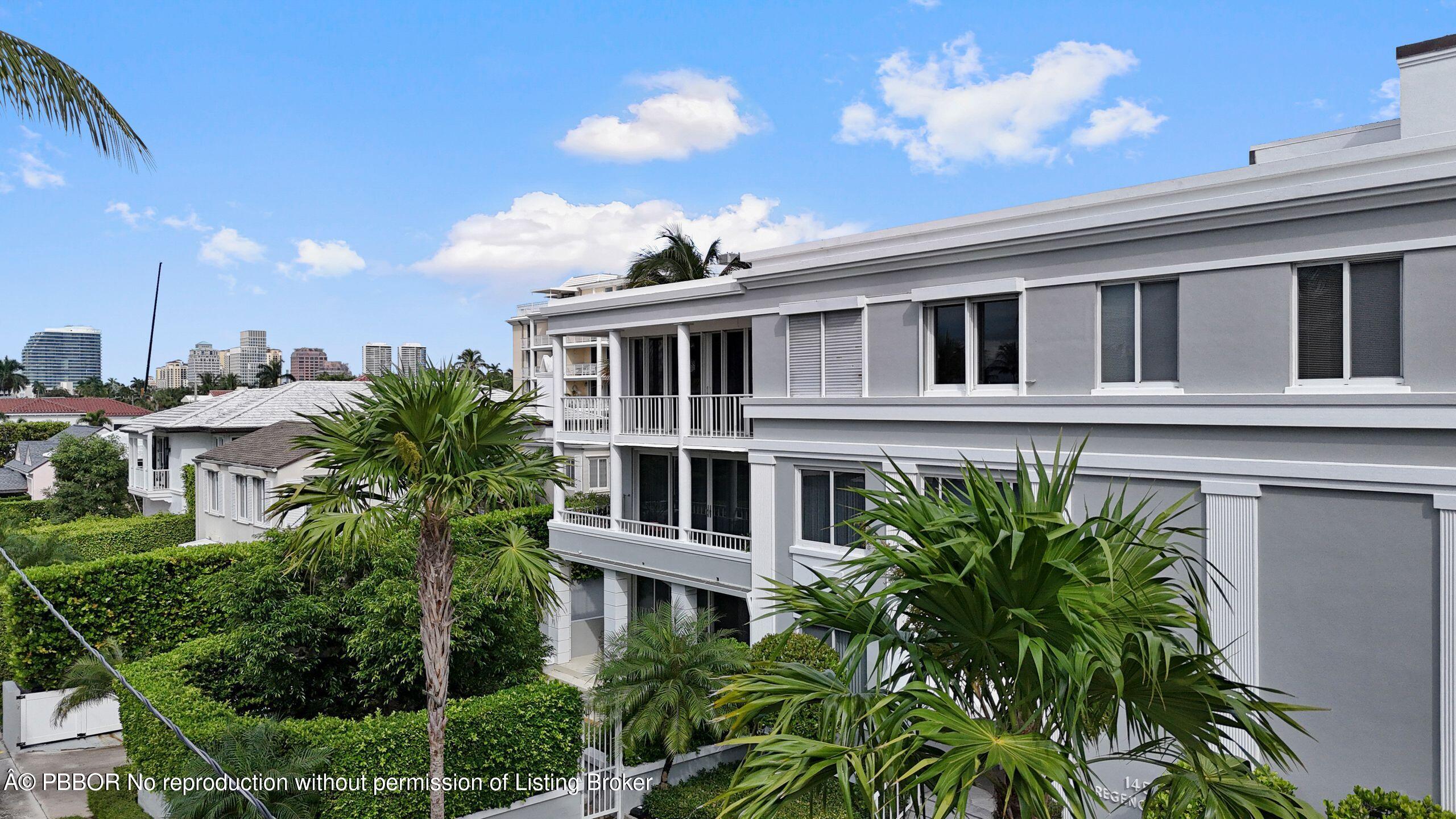 145 Peruvian Avenue, Unit 3010 Palm Beach, FL 33480 - Photo 17 of 18 a front view of a building with a yard