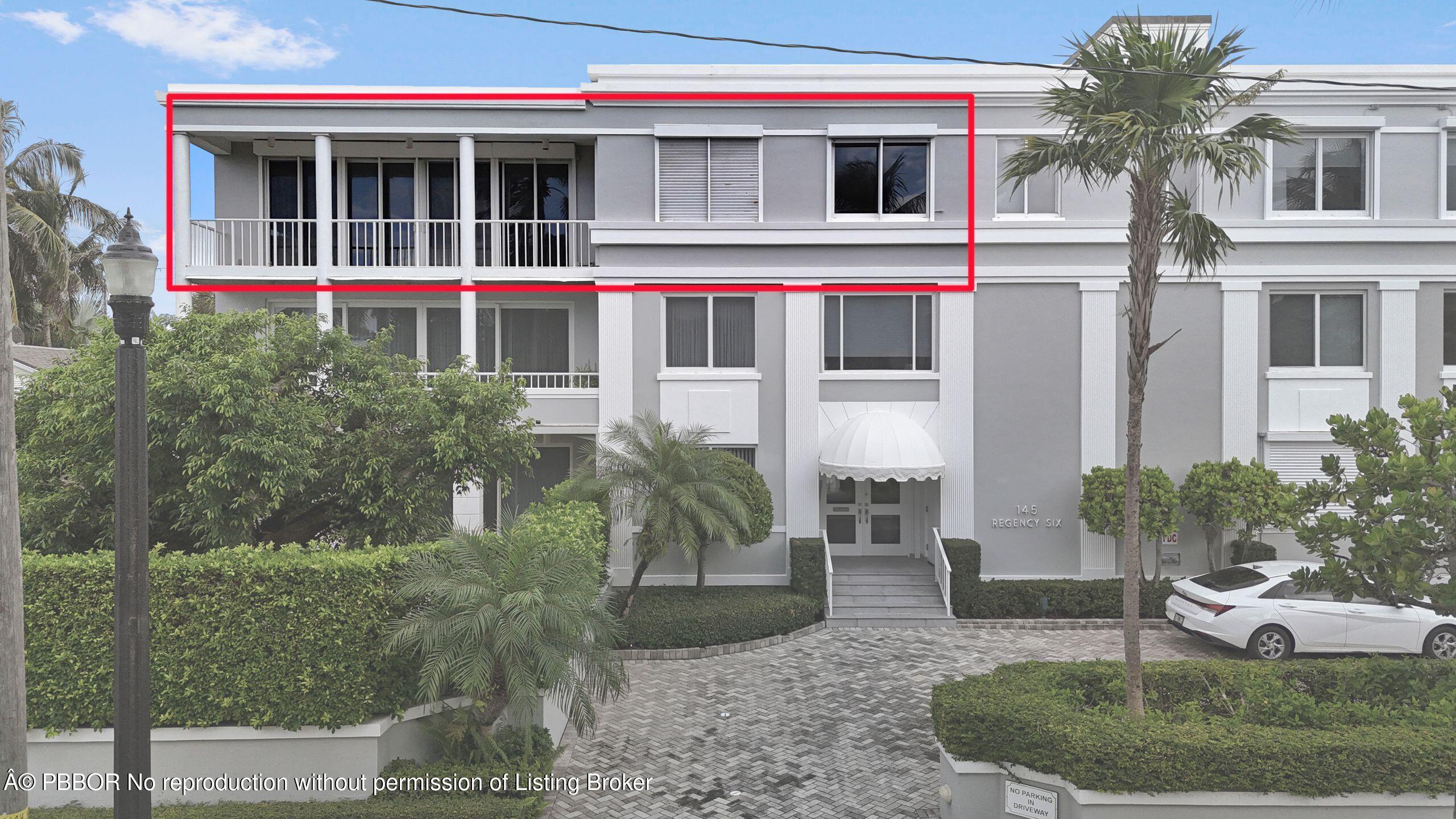 145 Peruvian Avenue, Unit 3010 Palm Beach, FL 33480 - Photo 3 of 18 a front view of a house with a yard and potted plants