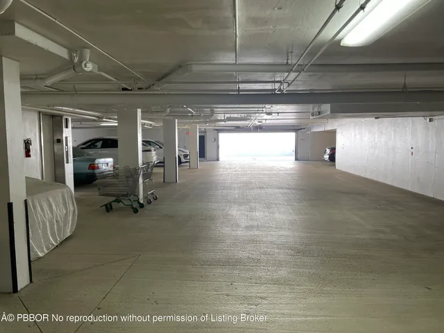 a room with gym equipment and large mirror