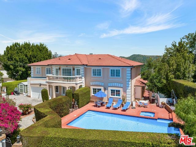 an aerial view of a houses with outside space