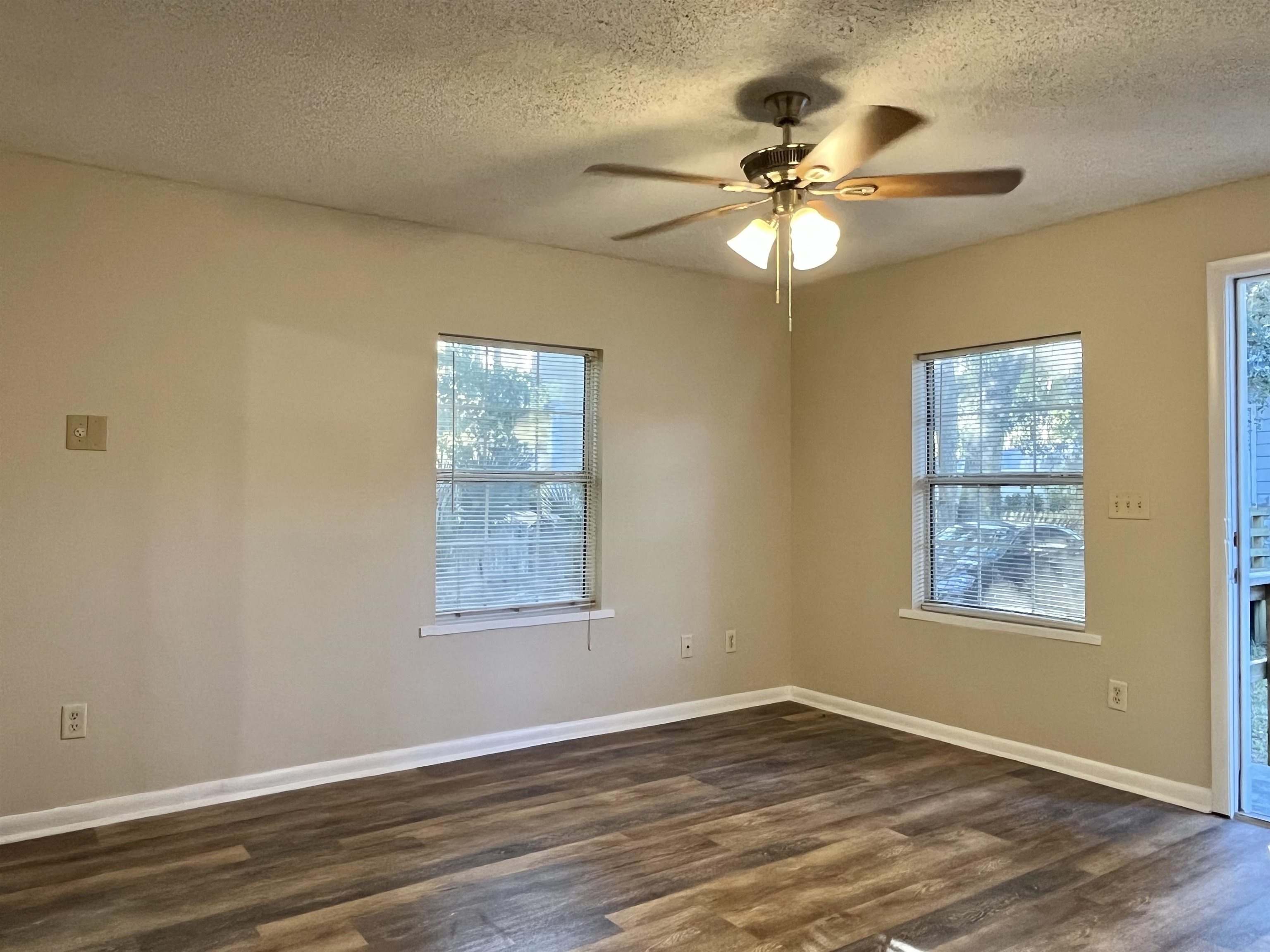 33 Evergreen Avenue, Unit B St. Augustine, FL 32084 - Photo 8 of 13 a view of an empty room with wooden floor and a window