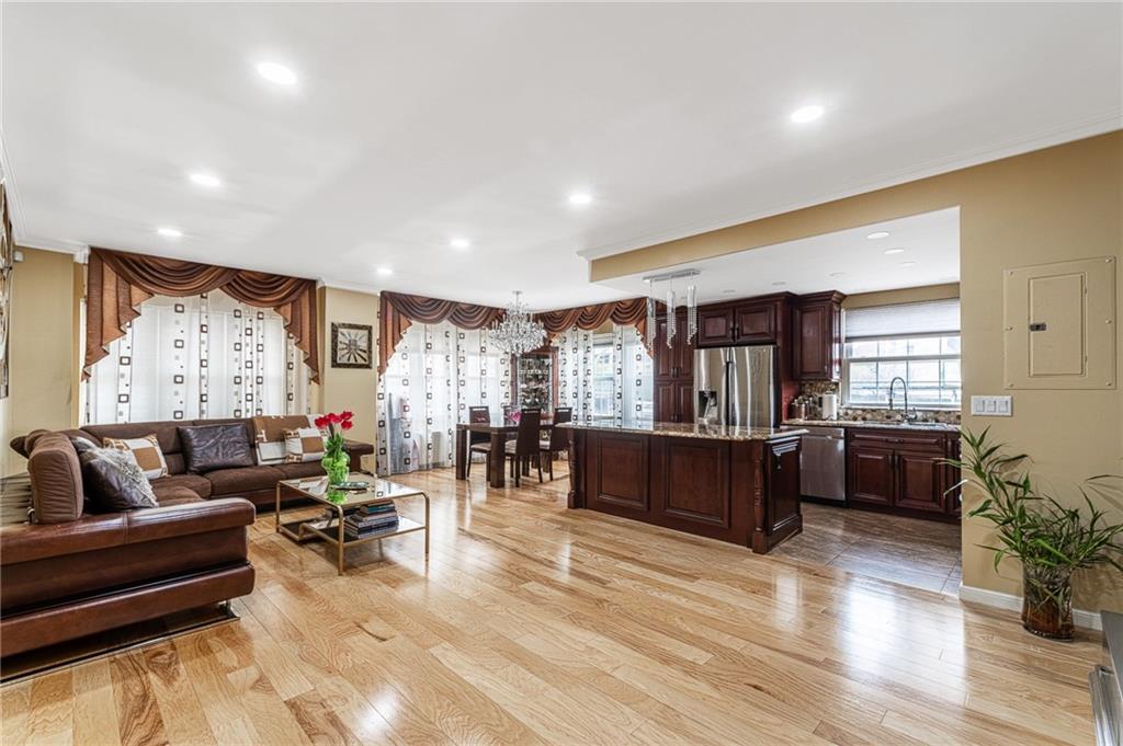 135 Oceana Drive East, Unit 1B Brooklyn, NY 11235 - Photo 1 of 23 a living room with furniture and wooden floor