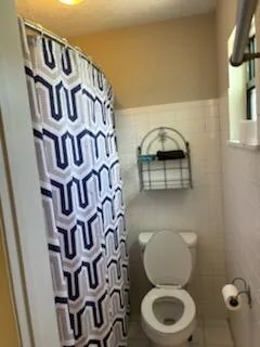 a bathroom with a toilet and a sink