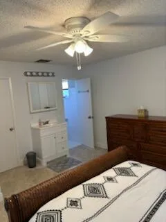 a bedroom with a bed and a mirror