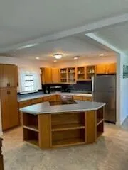 a room with furniture and a flat screen tv