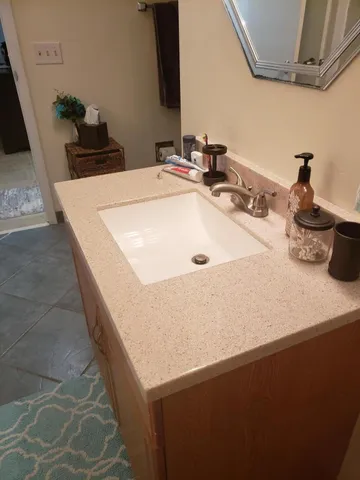 a bathroom with a sink and a mirror