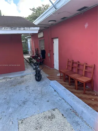 a view of a chairs and table in the patio