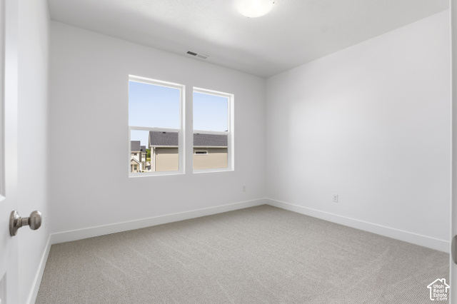 79 South Crimson Way West, Unit 307 Mapleton, UT 84664 - Photo 28 of 42 Neutral carpet flooring and white walls