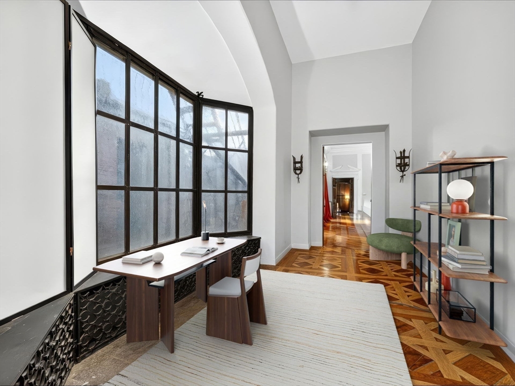 93 Beacon Street, Unit 5 Boston, MA 02108 - Photo 4 of 10 a living room with furniture a rug and a window