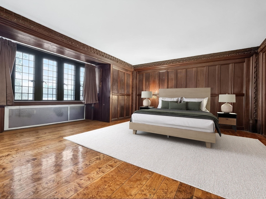 93 Beacon Street, Unit 5 Boston, MA 02108 - Photo 5 of 10 a bedroom with a bed and a large window