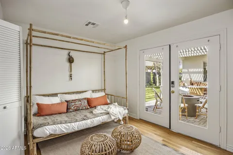 a bedroom with a bed and a couch