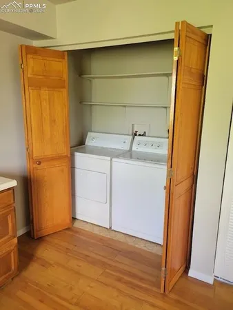 a kitchen with a refrigerator and a sink