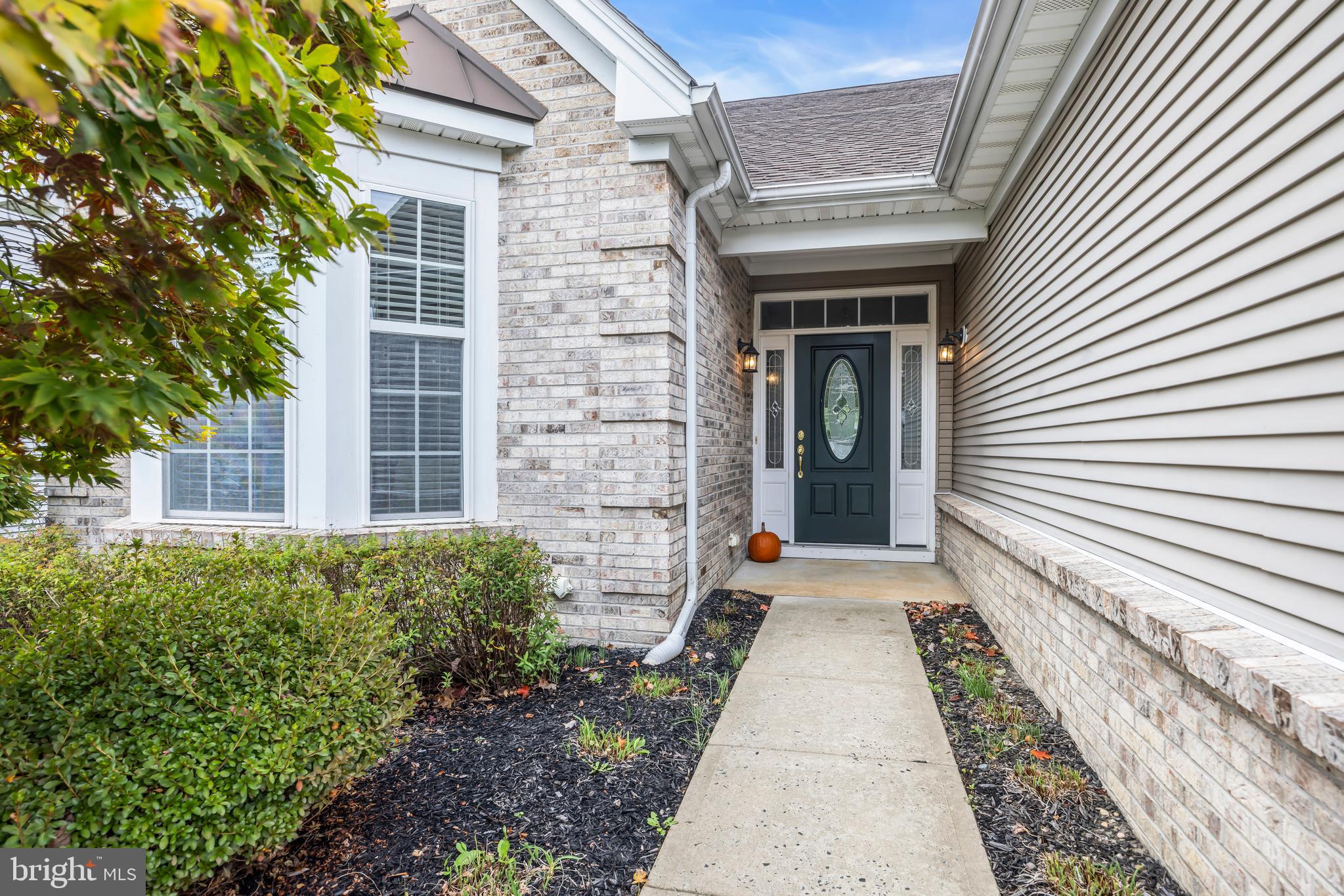 8 Barbados Court Hamilton, NJ 08691 - Photo 2 of 31 a pathway of a house with potted plants