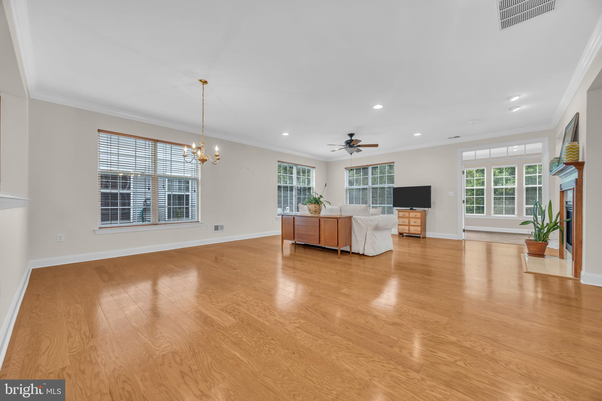 8 Barbados Court Hamilton, NJ 08691 - Photo 5 of 31 a view of empty room with wooden floor and windows