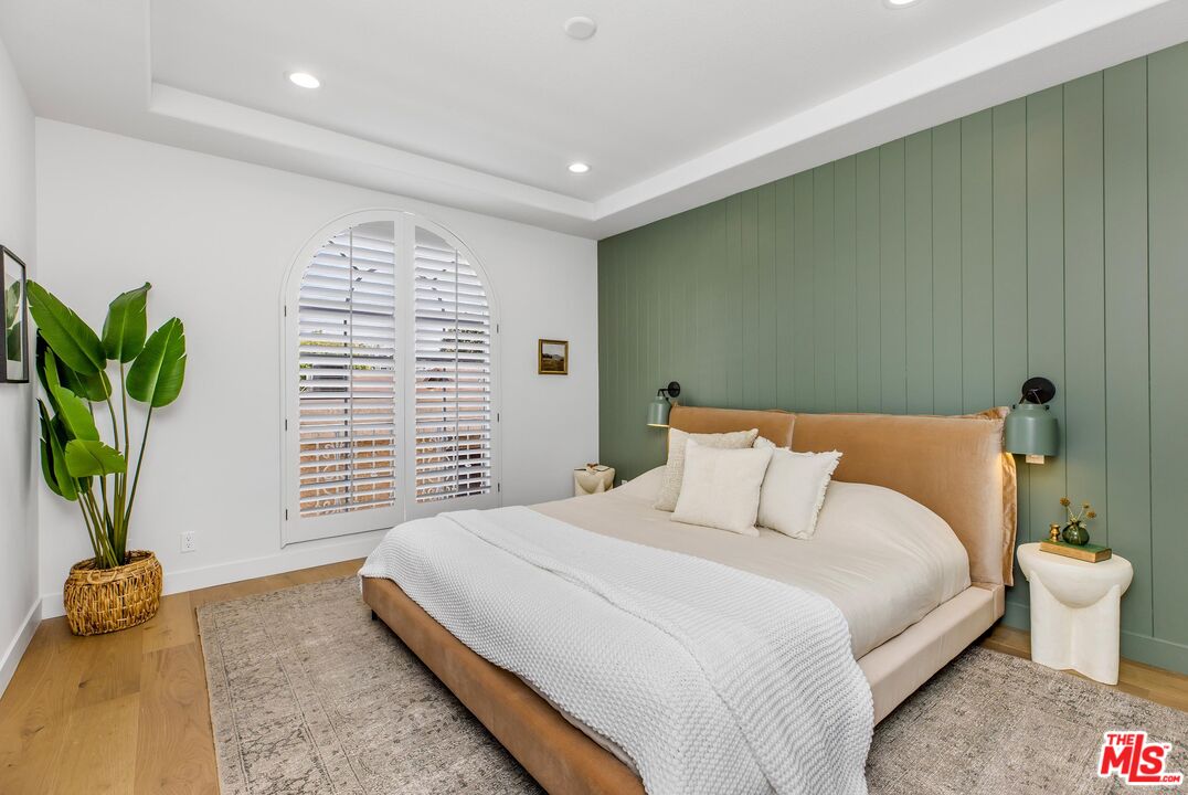 14234 Dickens Street, Unit 2 Sherman Oaks, CA 91423 - Photo 12 of 29 a bedroom with a bed and a window