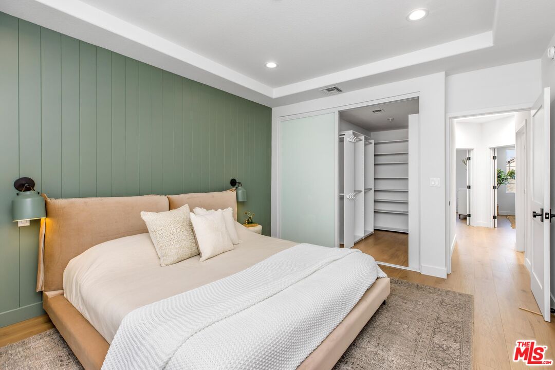 14234 Dickens Street, Unit 2 Sherman Oaks, CA 91423 - Photo 13 of 29 a bedroom with a bed and walk in closet