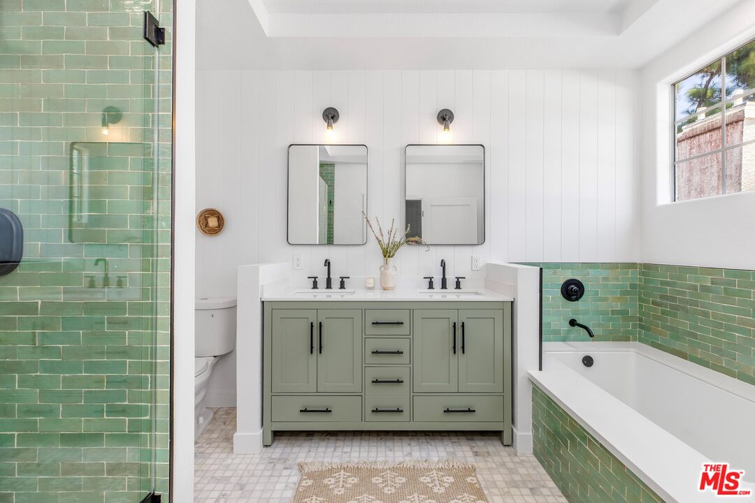 14234 Dickens Street, Unit 2 Sherman Oaks, CA 91423 - Photo 14 of 29 a bathroom with a bathtub sink and mirror