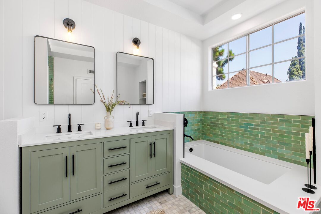 14234 Dickens Street, Unit 2 Sherman Oaks, CA 91423 - Photo 16 of 29 a bathroom with a double vanity sink mirror and bathtub