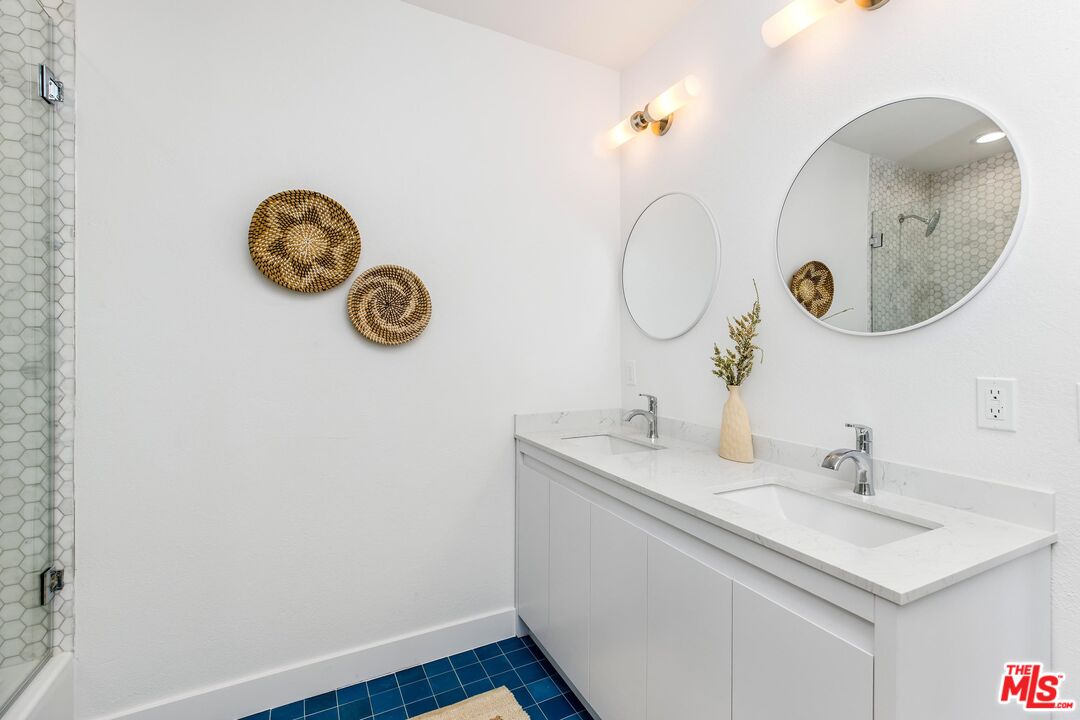 14234 Dickens Street, Unit 2 Sherman Oaks, CA 91423 - Photo 20 of 29 a bathroom with a sink and a mirror