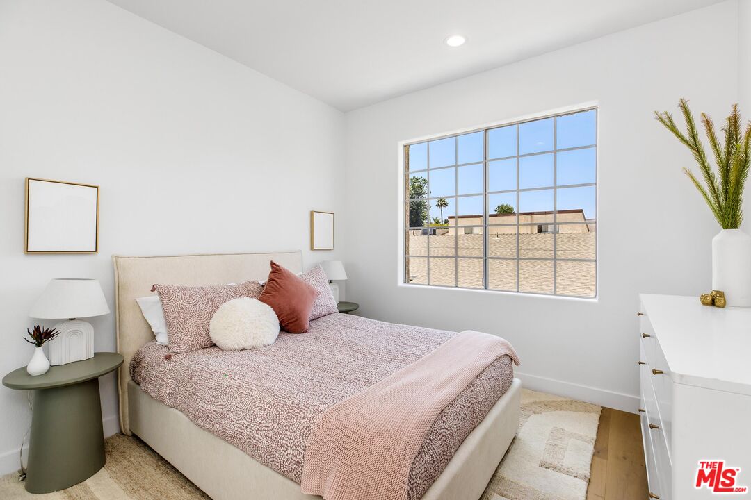 14234 Dickens Street, Unit 2 Sherman Oaks, CA 91423 - Photo 22 of 29 a bedroom with a bed and a window