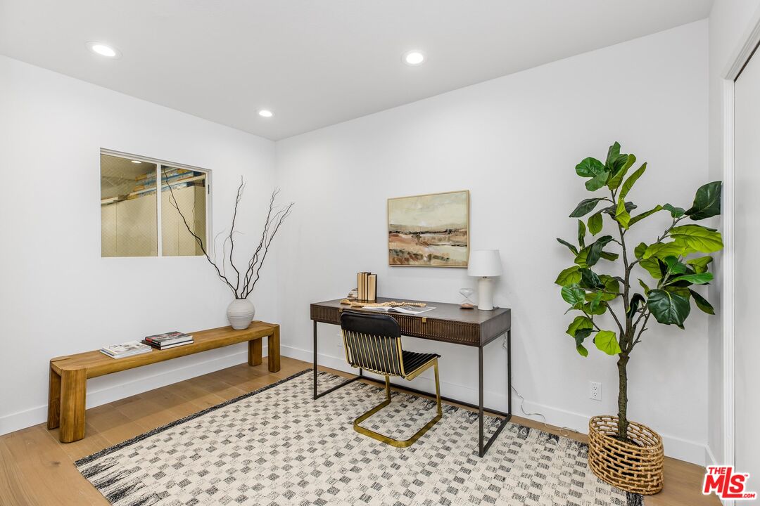 14234 Dickens Street, Unit 2 Sherman Oaks, CA 91423 - Photo 24 of 29 a living room with furniture and a potted plant