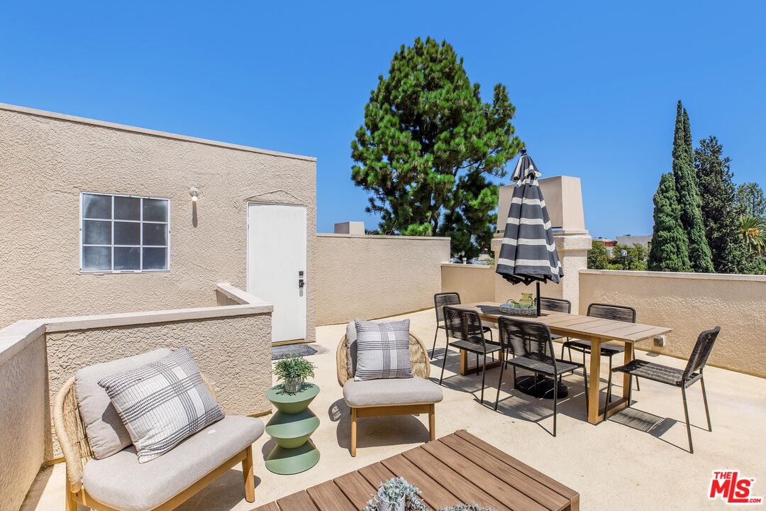 14234 Dickens Street, Unit 2 Sherman Oaks, CA 91423 - Photo 26 of 29 a terrace of a house with outdoor seating