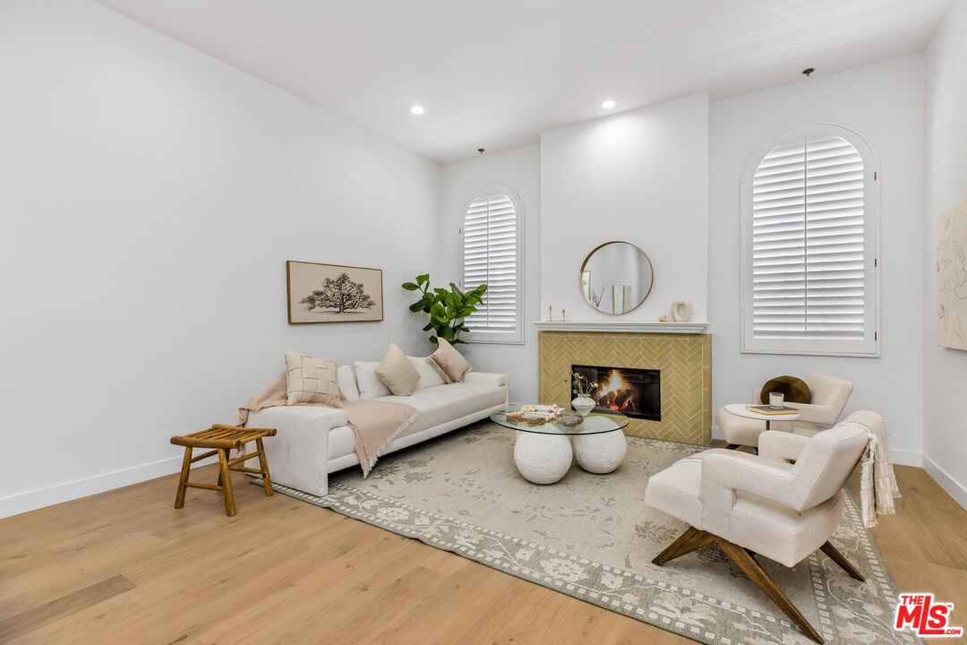 14234 Dickens Street, Unit 2 Sherman Oaks, CA 91423 - Photo 3 of 29 a living room with furniture and a fireplace
