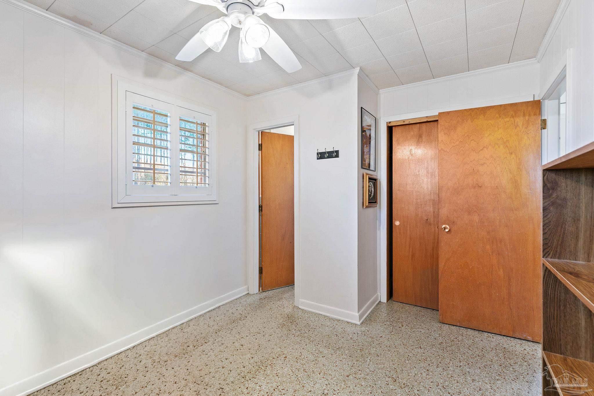 5024 Highway 21 Atmore, AL 36502 - Photo 22 of 38 an empty room with windows and closet