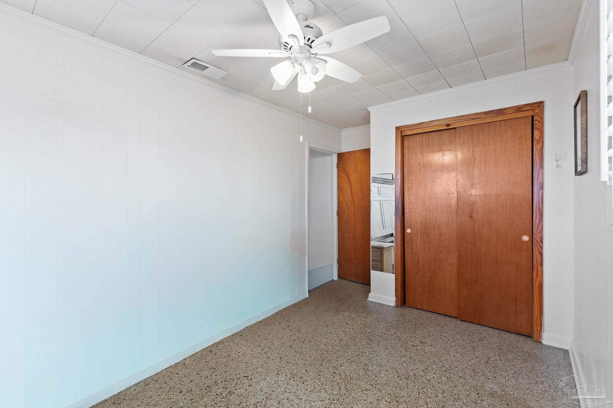 5024 Highway 21 Atmore, AL 36502 - Photo 30 of 38 an empty room with windows and fan