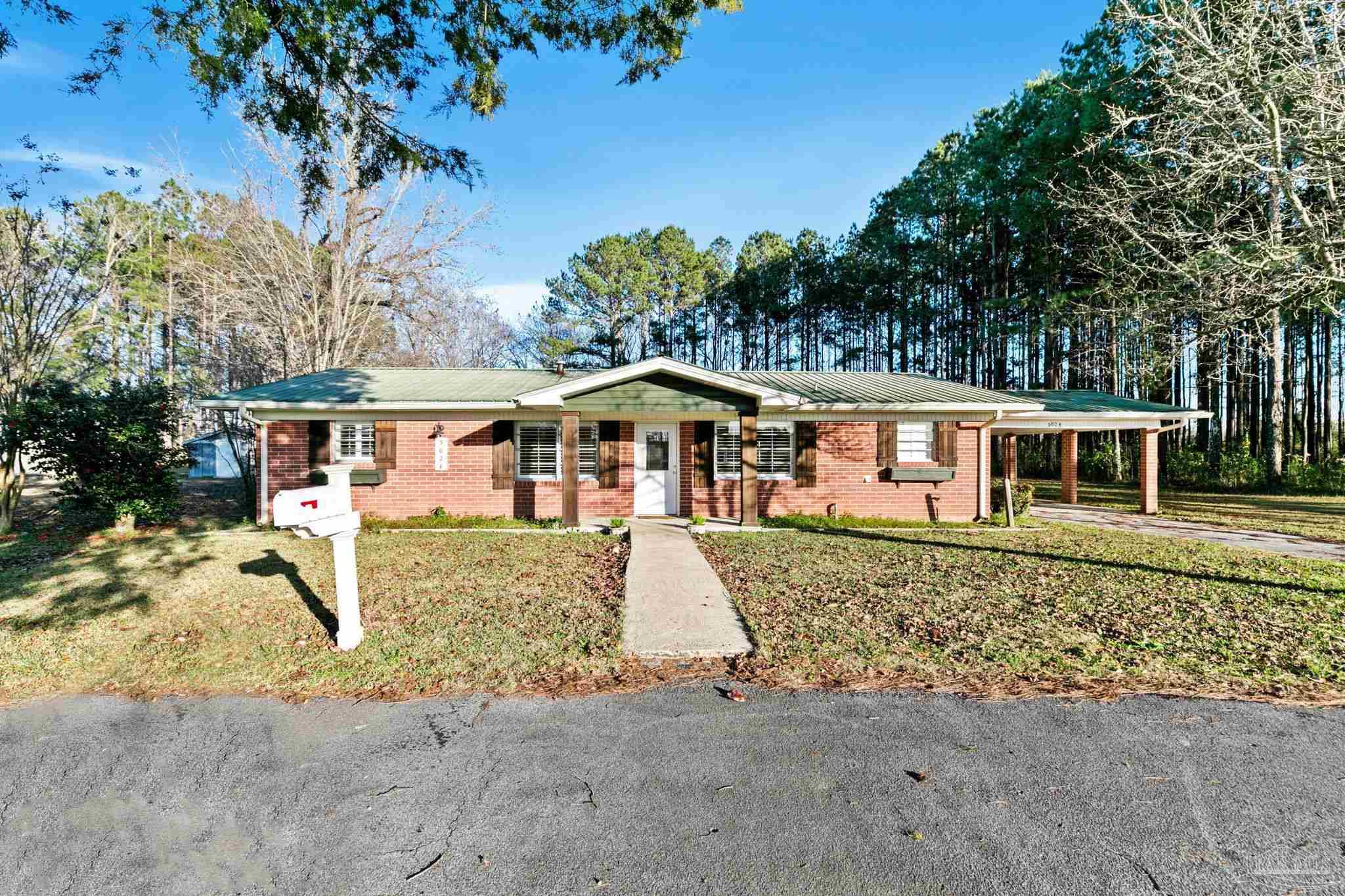 5024 Highway 21 Atmore, AL 36502 - Photo 6 of 38 front view of a house with a yard