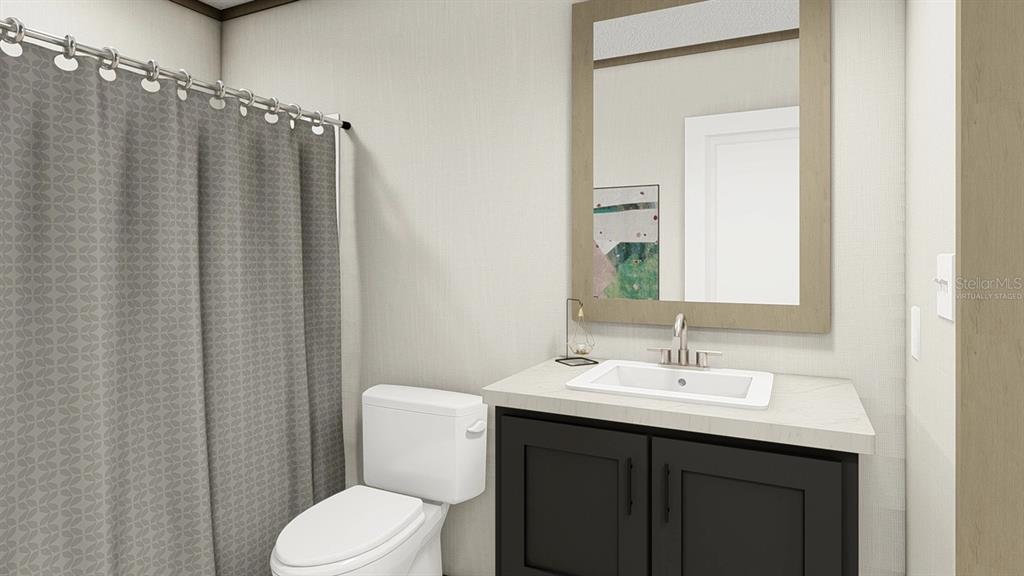 40410 Country Road Eustis, FL 32736 - Photo 12 of 16 a bathroom with a sink a toilet and shower curtain