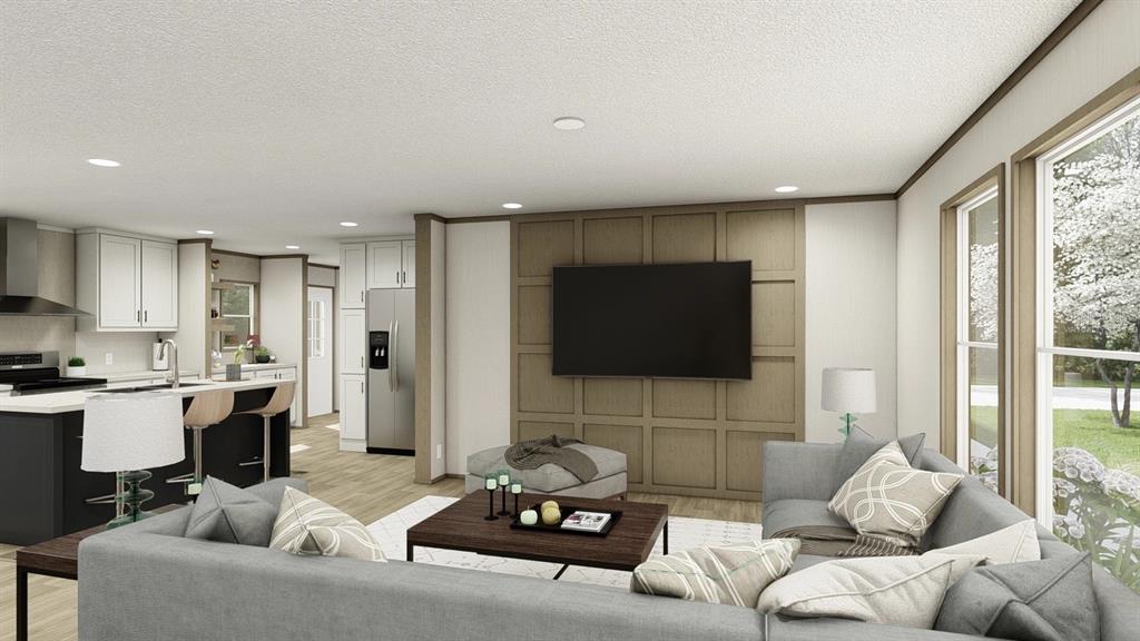 40410 Country Road Eustis, FL 32736 - Photo 2 of 16 a living room with furniture a flat screen tv and a large window