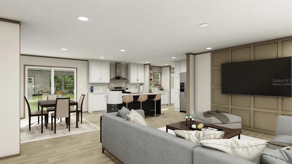 40410 Country Road Eustis, FL 32736 - Photo 3 of 16 a living room with furniture and a flat screen tv