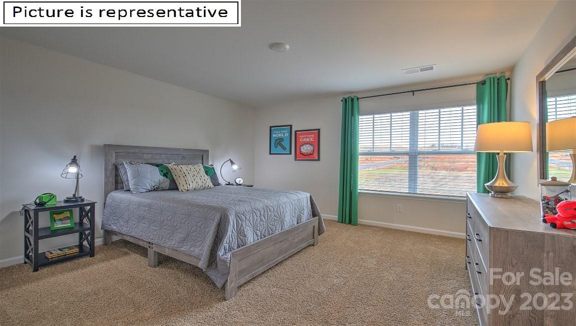 111 Beech Tree Lane Locust, NC 28097 - Photo 31 of 37 a spacious bedroom with a bed and a window