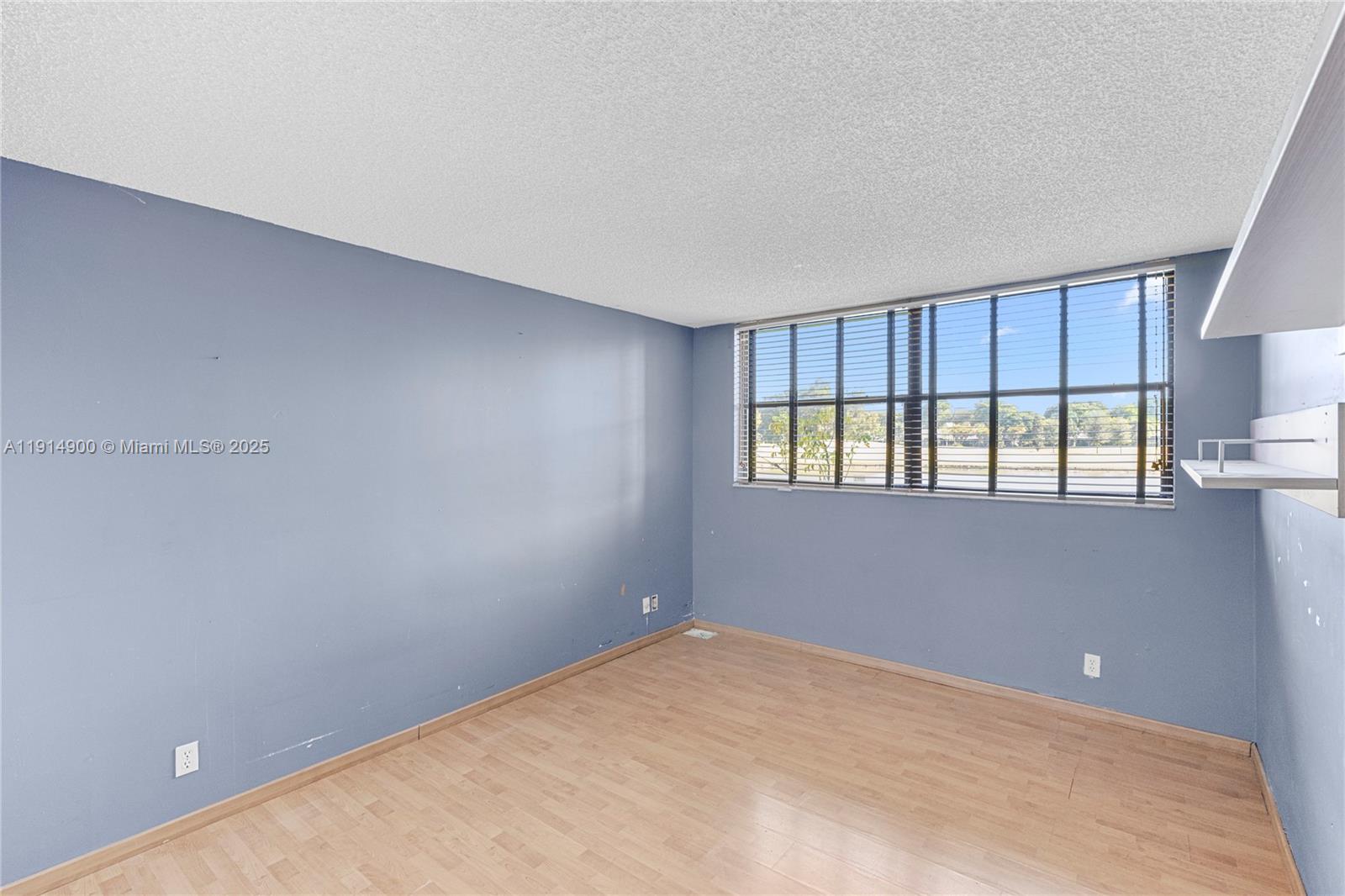 16100 Golf Club Road, Unit 101 Weston, FL 33326 - Photo 11 of 35 a view of an empty room with a window