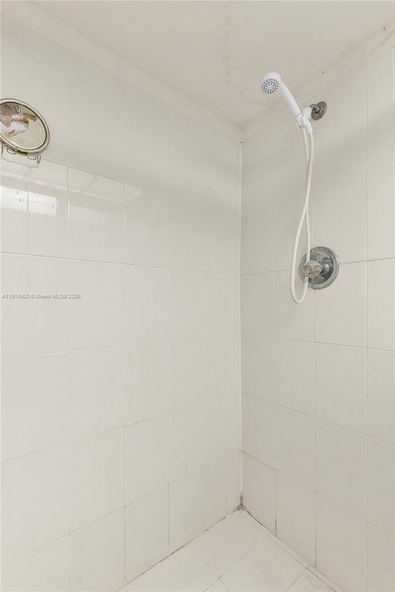 16100 Golf Club Road, Unit 101 Weston, FL 33326 - Photo 15 of 35 a bathroom with a shower