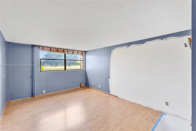 a bedroom with a bed and cabinets