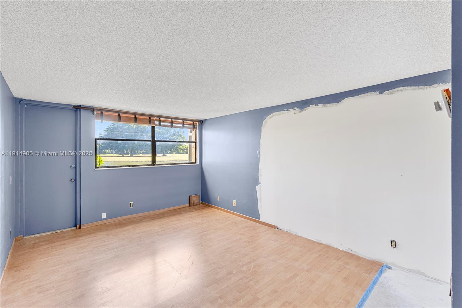 16100 Golf Club Road, Unit 101 Weston, FL 33326 - Photo 18 of 35 a bedroom with a bed and cabinets