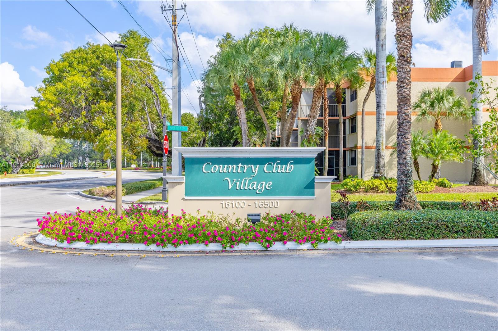 16100 Golf Club Road, Unit 101 Weston, FL 33326 - Photo 2 of 35 a sign on the side of a street