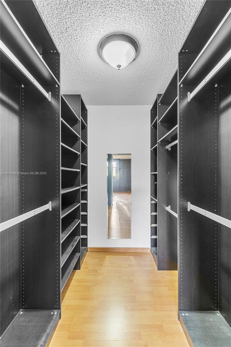 16100 Golf Club Road, Unit 101 Weston, FL 33326 - Photo 21 of 35 a view of room with closet and windows