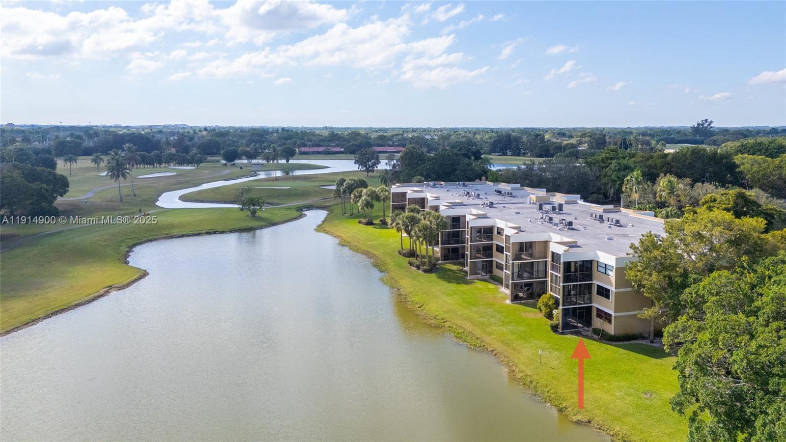16100 Golf Club Road, Unit 101 Weston, FL 33326 - Photo 26 of 35 an aerial view of a house with a swimming pool outdoor seating and yard