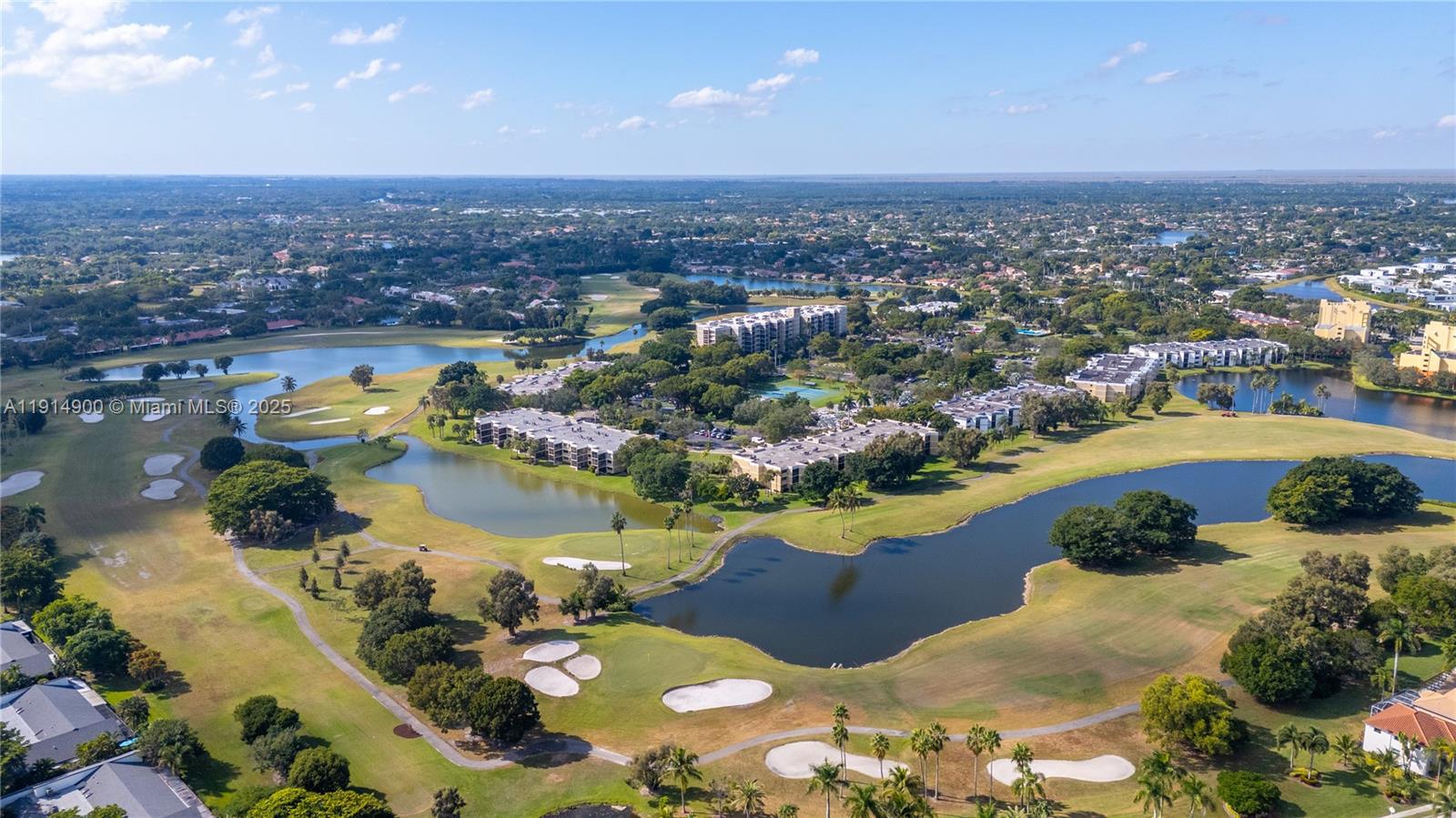 16100 Golf Club Road, Unit 101 Weston, FL 33326 - Photo 32 of 35 an aerial view of residential houses with outdoor space