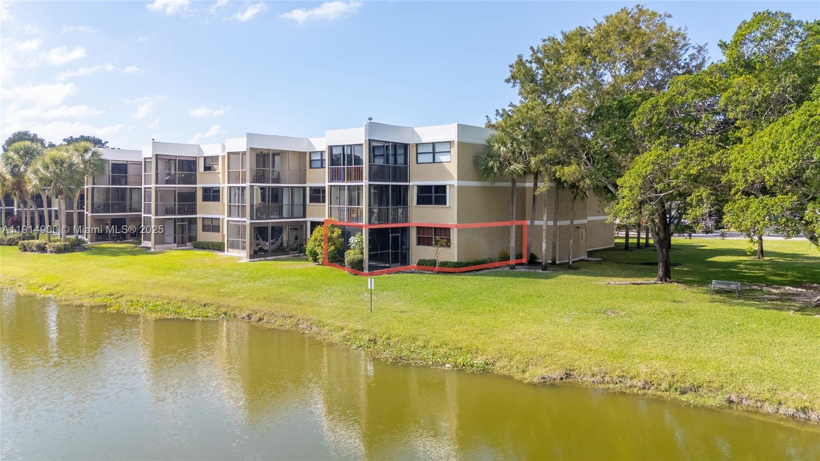 16100 Golf Club Road, Unit 101 Weston, FL 33326 - Photo 33 of 35 a view of a swimming pool with an outdoor space and seating area