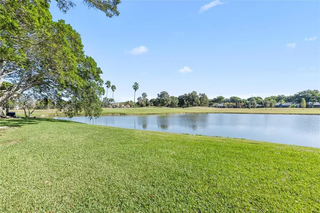 a view of a lake with houses in the background