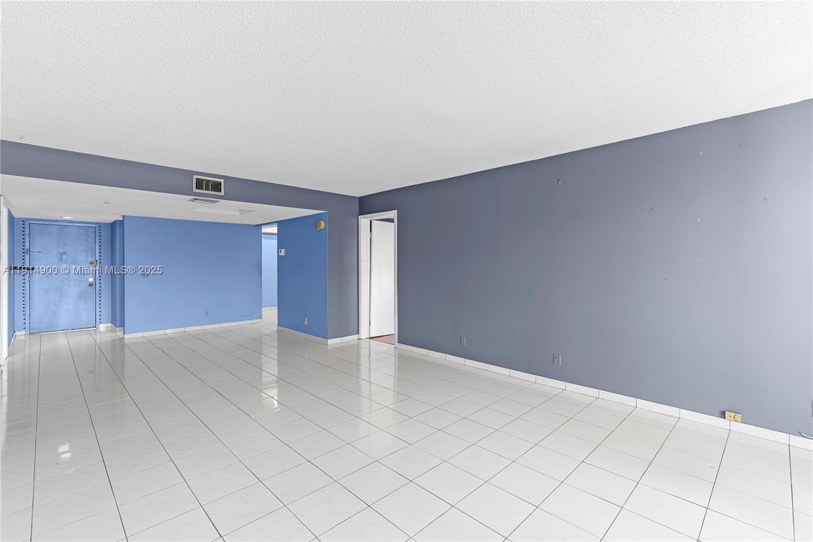 16100 Golf Club Road, Unit 101 Weston, FL 33326 - Photo 6 of 35 a view of an empty room and window