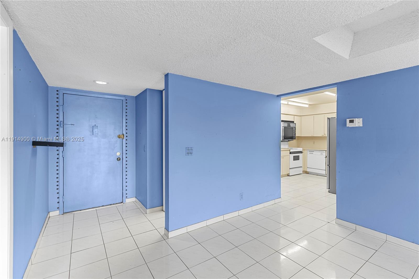 16100 Golf Club Road, Unit 101 Weston, FL 33326 - Photo 7 of 35 a view of an empty room and a bathroom