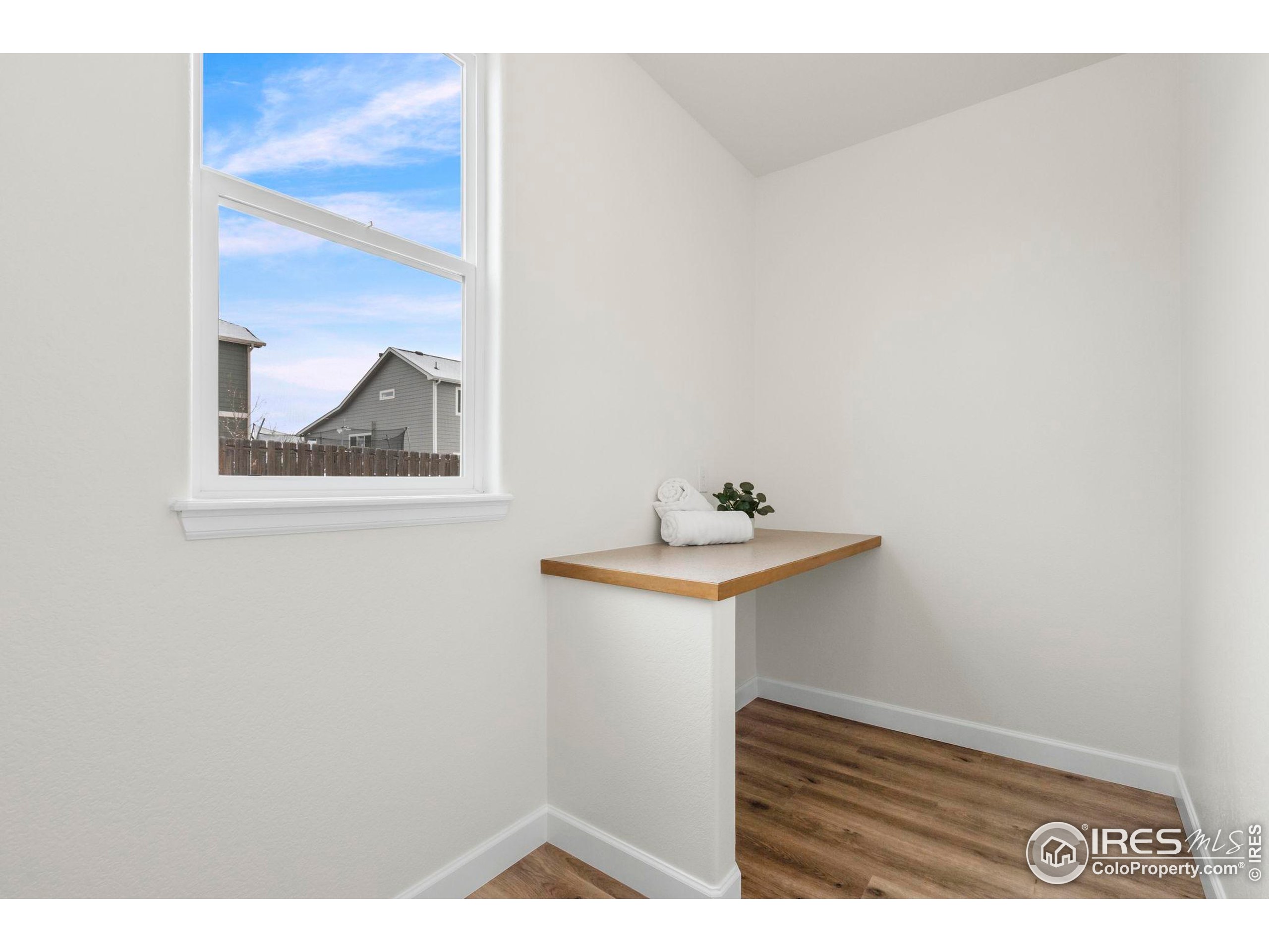 7324 Atlantis Street Wellington, CO 80549 - Photo 13 of 31 a bathroom with a sink and a mirror