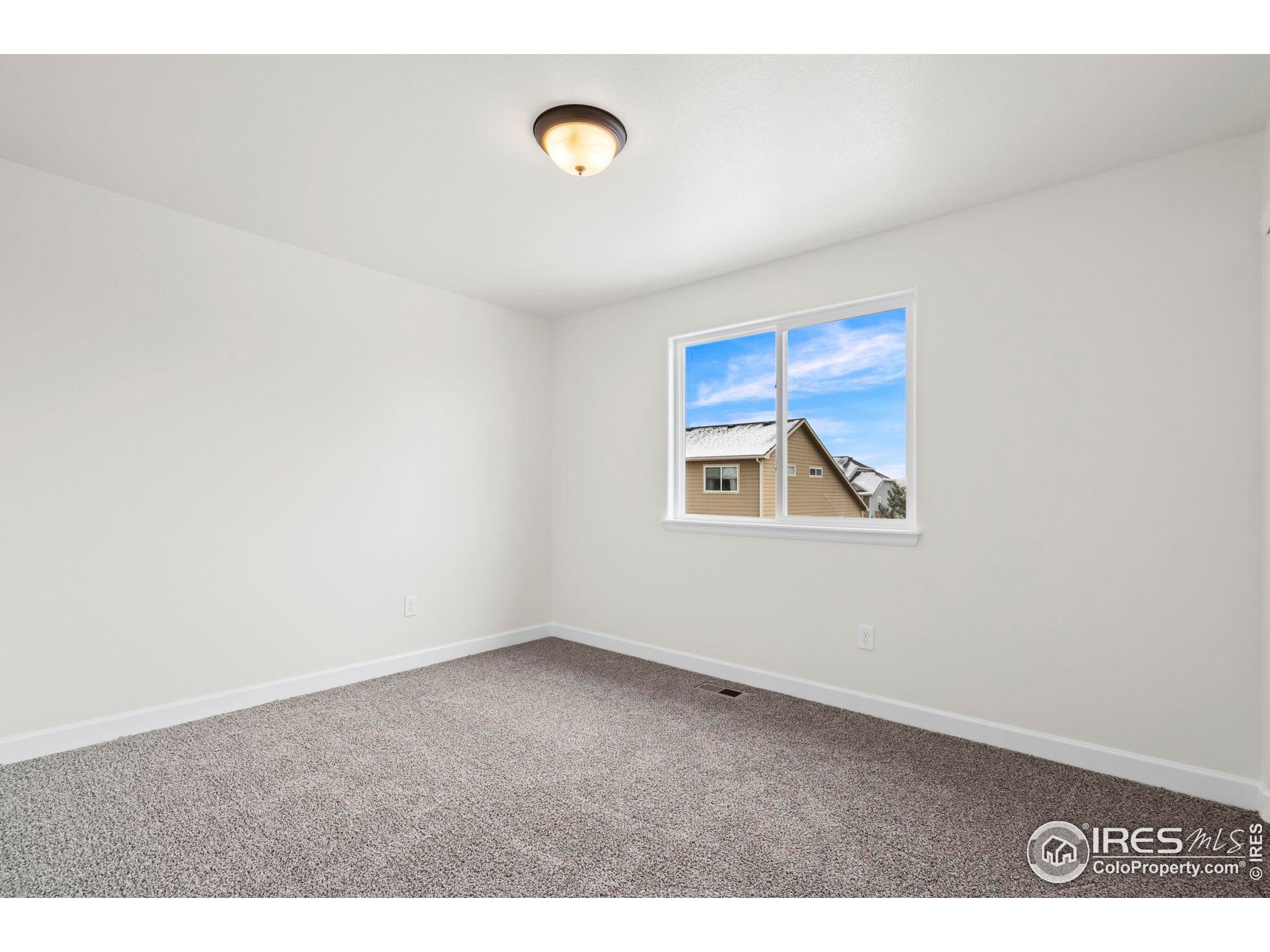 7324 Atlantis Street Wellington, CO 80549 - Photo 16 of 31 a view of empty room with window