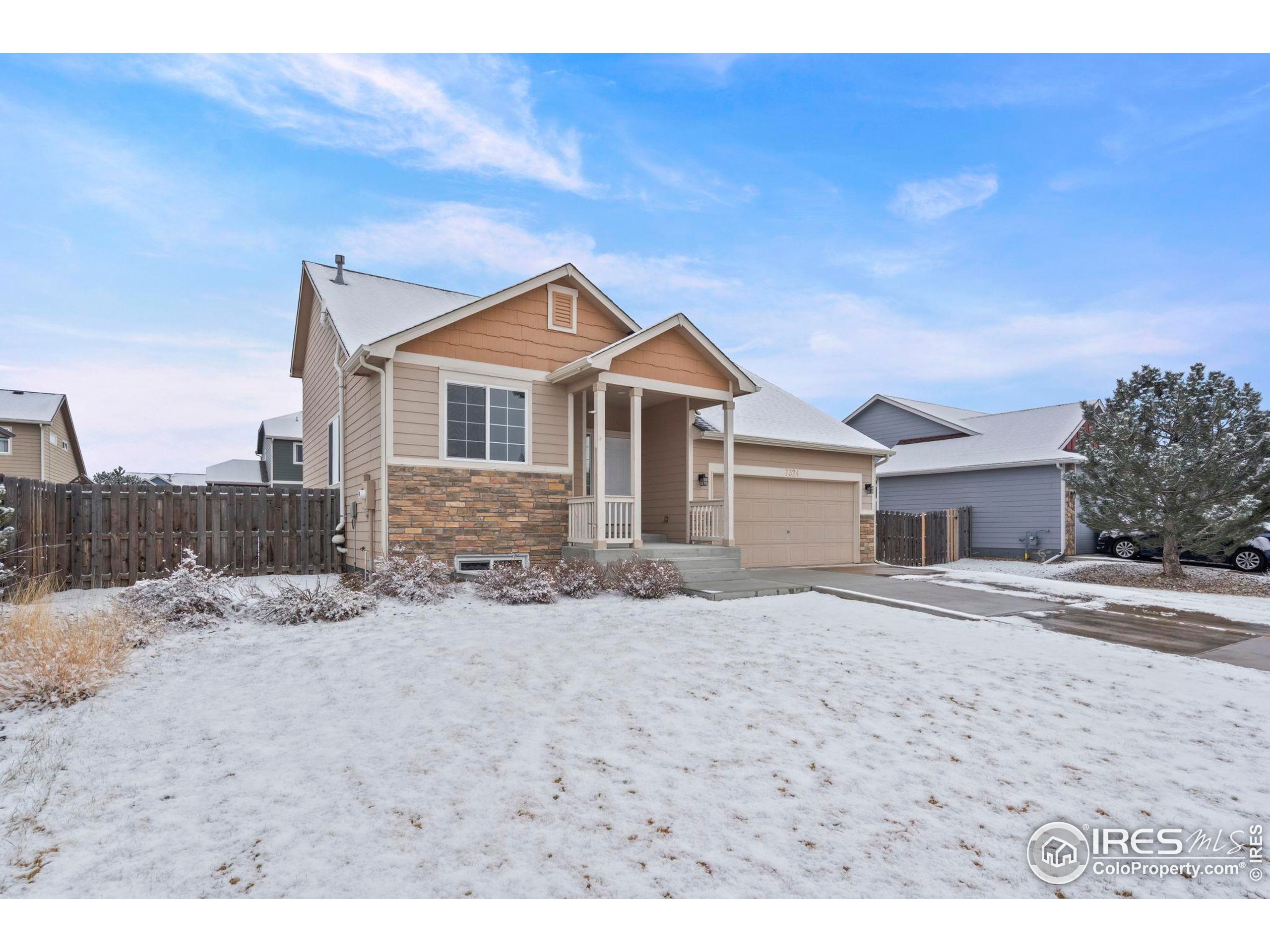 7324 Atlantis Street Wellington, CO 80549 - Photo 29 of 31 a big house with a big yard and more windows