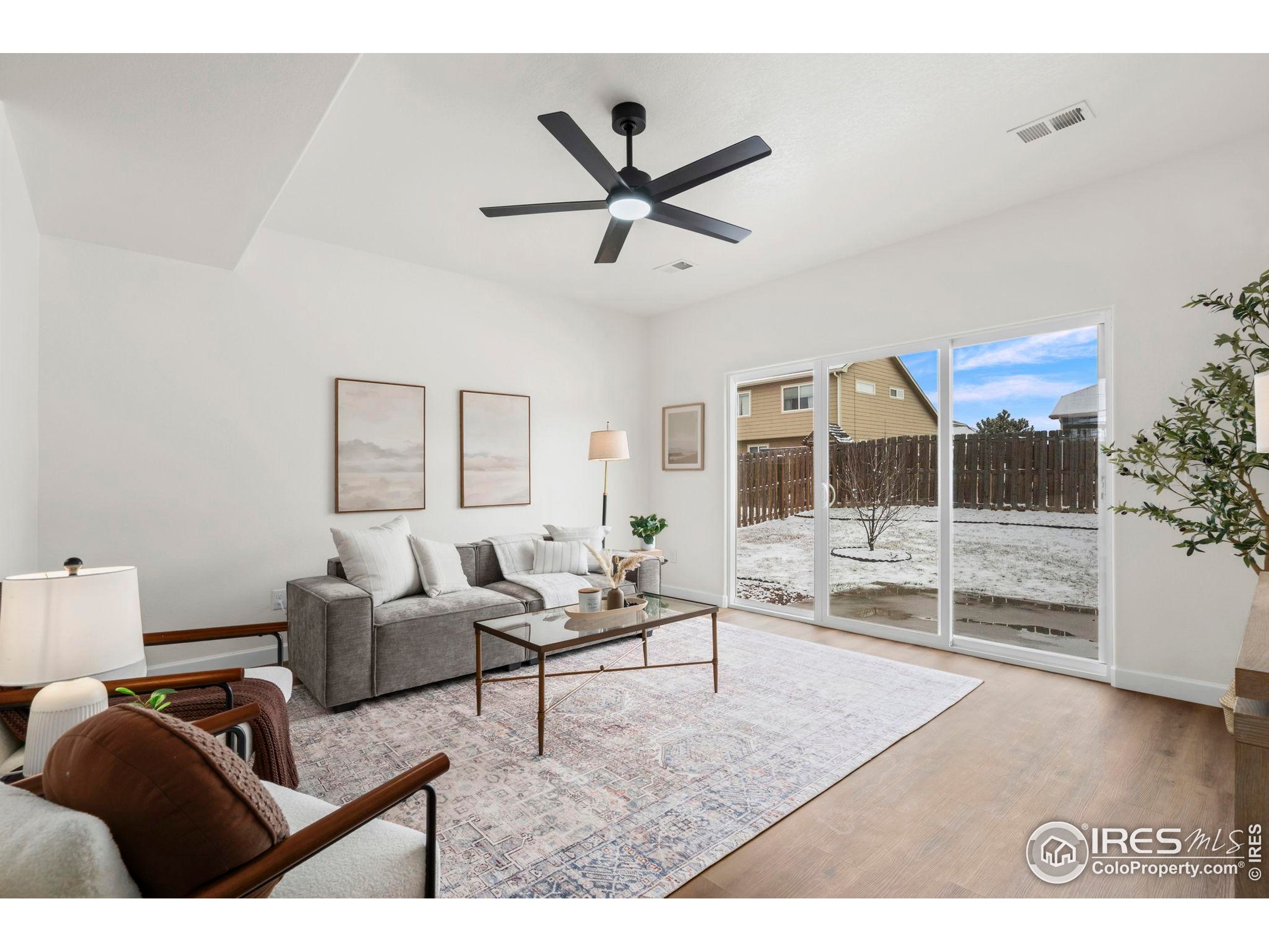 7324 Atlantis Street Wellington, CO 80549 - Photo 10 of 31 a living room with furniture